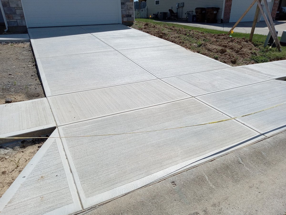 Home building with new driveway